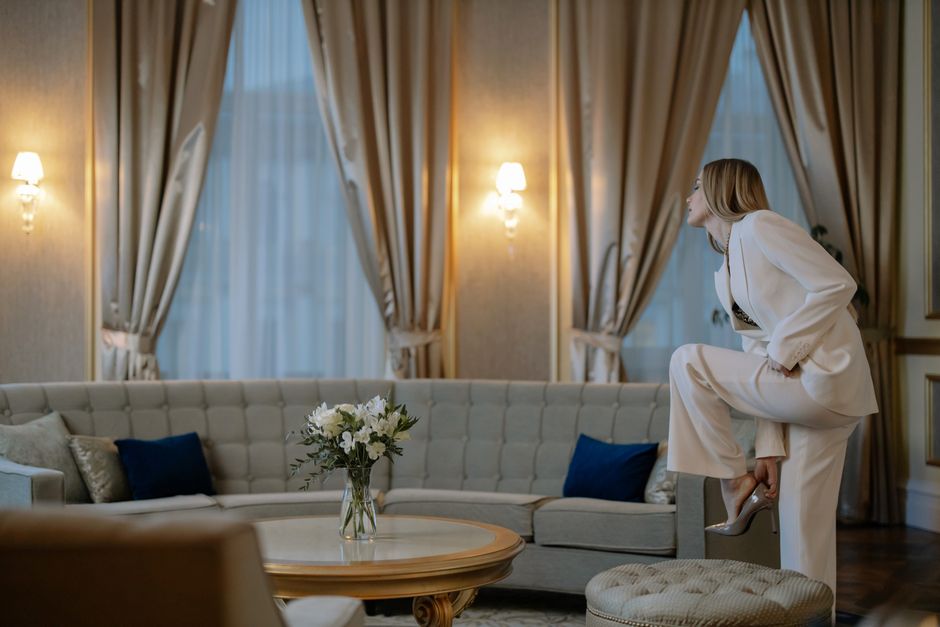 Woman with glowing bronze skin in an elegant home setting in Frisco TX